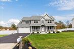 Welcome to this modern colonial in Farmingville, built less than 5 years ago and ideally located just 5 minutes from the Ronkonkoma train stationâ€”with direct access to NYC in about an hour. Nestled on a quiet, extra-wide street and backing onto protected land, the home sits on over a half-acre lot offering privacy and a serene backyard setting.With 5 bedrooms and 4.5 baths spread across three finished levels, the home offers a flexible and well-appointed layout. The main floor features a welcoming sitting area with fireplace, a spacious open kitchen with access to the rear deck, and a bedroom with a full bathâ€”perfect for guests or extended living. Upstairs, youâ€™ll find two generous bedrooms, a full bath, laundry, and a stunning primary suite complete with sitting area, walk-in closet, and spa-like en-suite bath.The finished lower level offers even more living space with an entertainment area, two bonus rooms, a full bath, additional laundry, and walkout access to the backyard.The location is unbeatableâ€”offering easy access to both the North and South Shores of Long Island and just minutes from the area&rsquo;s best amenities, including Whole Foods, Wegmans, Smith Haven Mall, and a variety of shopping and dining options in Lake Grove.Meticulously maintained and thoughtfully designed throughoutâ€”this is a home you wonâ€™t want to miss.