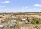 **Endless Opportunities Await on This Rare 3.2-Acre Property!** ZONED COMMERCIAL INDUSTRIAL USEFor the first time in over 50 years, this prime piece of real estate is hitting the market! Nestled right off Route 17 with unbeatable exposure, this unique 3.2-acre property offers **unlimited potential** for investors, developers, or those looking for a special place to call home. Featuring **four structures**â€”a **spacious main house, a charming smaller home, and two barns**â€”the possibilities are endless. Whether you envision a multi-generational estate, a business venture, or a farmstead, this property is ready for your imagination to bring it to life. With its **high-visibility location** and vast open space, this is a rare find that wonâ€™t last long. **Come explore the potential and make your vision a reality!**