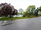Investorâ€™s Dream â€“ 27, 000+ Sq Ft Corner Lot at Mayfield Dr & Pineway AveExceptional opportunity for investorsâ€”sprawling 27, 000+ sq ft corner lot located at the intersection of Mayfield Dr and Pineway Ave with endless potential. The home features 3 bedrooms, 1 full bath, a dining room, and a kitchen with a rear door that leads to a spacious deckâ€”ideal for outdoor enjoyment or expansion.A detached structure with its own private driveway access from Pineway Ave provides additional space with flexible possibilities for the right buyerâ€™s vision.Additional highlights include an attached 1-car garage and an unfinished partial basement with exterior-only access. Located just minutes from William Floyd High School and major thoroughfares. Sold as-is. A rare chance for developers, flippers, or buy-and-hold investors to capitalize on size, location, and future upside. Buyer to verify all uses and permits.