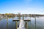 Experience the beauty of this stunning newly constructed waterfront home perfectly situated on Meeting House Creek. With its large oversized dock and deep water access, this home is a boater&rsquo;s dream. Step inside to discover a spacious interior boasting 3 bedrooms, 3 full bathrooms, and a versatile flex room that can be used as an en-suite bedroom or additional living space on the main level. The open concept great room features a chef&rsquo;s kitchen, dining area, and living room, creating the ideal space for entertaining. Upstairs, find two guest bedrooms, including one with a water-side balcony, a full bathroom, and a truly impressive master bedroom with an en-suite bathroom and water-side balcony. Outside, the rear yard offers a large stone patio, fire-pit, and a red brick walk-way that leads to the home&rsquo;s impressive deepwater dock. Located on Overlook Dr, a private road that juts out into the bay, you&rsquo;ll enjoy fantastic water access to the Great Peconic Bay and all it has to offer.