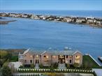 One Of A Kind-Waterfront StunnerThis extraordinary custom-built waterfront estate is an architectural masterpiece, offering over 14, 000 sq ft of exquisitely designed living space. Perfectly situated on 1.47 acres of open bayfront, this home features 8 spacious bedrooms, 10 bathrooms, a private bulkhead dock for boat and jet skis-delivering a one-of-a-kind lifestyle of comfort and elegance. Built by George Vickers Enterprises and designed/furnished by Joe Del Percio Design, every element was crafted with unmatched attention to detail. Enter through an oversized solid walnut door into a sun-drenched grand foyer with soaring cathedral ceilings, a large coat closet with custom glass doors, and a powder room adorned in luxurious vanilla onyx. The expansive living room boasts floor-to-ceiling 6-panel sliding glass doors showcasing breathtaking water views, a gas fireplace with Classico Antico stone surround, and a custom acoustic-paneled ceiling with integrated LED lighting. The gourmet kitchen is centered around a massive King White leathered quartzite island. Premium appliances include a Wolf 6-burner range, double wall ovens, 2 Bosch dishwashers, Sub-Zero refrigerator/freezer, ice maker, beverage drawers, and a Shaws England farmhouse sink. A tumbled brick coffered ceiling with pendants and recessed lighting adds character, while a walk-in pantry provides ample storage. The adjacent formal dining area is perfectly positioned to capture panoramic bay views. The family room features walnut lacquered radius walls, custom sconces, and closes with walnut pocket doors for added privacy. A stylish clubroom offers multiple seating areas, a sleek white quartz bar with fridge, and a climate-controlled wine room ideal for collectors. The first-floor junior primary suite offers dual walk-in closets, a sitting area, radiant-heated floors, and a spa-like bath with dual quartz vanities, private water closet, and a White Rhino leathered stone steam shower. A separate entry leads to a custom mudroom with built-ins and bench seating, connecting to a 3-car garage with lifts for up to 5 vehicles. The laundry room features double Electrolux washer/dryer sets and a convenient powder room nearby. Upstairs, the stunning primary suite includes a private covered deck with water views, private sitting room/office, his-and-her walk-in closets with custom islands, and a luxurious en-suite bath. The bathroom features dual vanities, 2 water closets, a steam shower with touchscreen controls, radiant heat, and a private outdoor shower facing the bay. White Rhino leathered stone floors and white quartz counters complete the space. The second floor also includes a spacious living/media room with a 100-inch TV and access to the upper deck, three additional en-suite bedrooms with designer baths with radiant heat, a second laundry room, and a private guest wing with two en-suite bedrooms, a kitchenette, and separate entrance. The lower level is a haven for wellness and fun, featuring a state-of-the-art gym, infrared sauna, cold plunge, game room with basketball and shuffleboard, a recreation lounge with kitchenette, and a bunkroom that sleeps seven. Radiant heat and ample storage complete this level, with walk-out access to a covered patio and the backyard. Outdoor living is unrivaled. A heated saltwater pool with built-in spa and sun ledge overlooks the bay, surrounded by expansive decks-both covered and uncovered-with recessed lighting, fans, built-in speakers, fire pit, and Centor retractable screens. A fully equipped outdoor kitchen, BBQ, cabana bathroom, and changing room make this the ultimate entertainment space. Offered Fully furnished and turn-key, the estate includes a Crestron Smart Home system, Lutron lighting, & whole-house Kohler generator. With unparalleled craftsmanship, designer finishes, and every amenity imaginable, this home is truly one of a kind. Too many details and amenities to list-Please inquire for a private showing & full feature sheet.