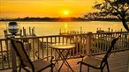 Nothing compares to this location and these views. Rare, open bay waterfront property with full western exposure that will bring each sunset streaming through your double set of sliding glass doors. Spend your days on the oversized raised deck taking in the ever-changing scenery off the open concept living room with beautiful vaulted wood ceilings. Featuring a recently renovated eat-in-kitchen (gas range and stainless steel appliances), and recently updated bathrooms (upstairs with bath/shower and double vanity; downstairs set up as a primary bedroom en suite), paired with gleaming hardwood floors and carefully maintained original brick and wood work; a first floor primary bedroom with en suite bathroom and french doors opening out to an open concept first floor family room. The house could be set up as a mother-daughter if proper permits were to be obtained. The spacious, fully decked backyard is ready made for entertaining. Park in the attached 2 car garage or the 3 car driveway, paved with decorative concrete for a nautical feel. Located on a very quiet road without through-traffic. Water frontage contains full bulk-heading with private pier, floating dock and boat lift. Whether you are heading out to fish, planning to pull up to a restaurant in style, or take a sunset cruise, being just a few short minutes from Reynolds Channel after cast off makes this location a boater&rsquo;s paradise. For non-water based transportation, it is a short trip to the Island Park LIRR Station (approx. 49 min train ride to Midtown Manhattan) and the Long Beach and Island Park shops, restaurants and beaches. Waterfront living with a practical commute to New York City.