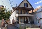 The three-family detached home at 88-30 172nd St, Jamaica, NY 11432, (2/3 Floors Del. Vacant) is a standout investment opportunity, offering 10 bedrooms, 4 bathrooms, and a fully finished basement across its 2, 852 sqft structure on a 40x100 ft (4, 000 sqft) lot zoned R4-1, ideal for multi-unit residential development. Configured as three independent units (1st floor: 4bd/2ba, 2nd floor: 4bd/1ba, 3rd floor: 3bd/1ba) with a basement featuring an additional bathroom, this property maximizes rental income potential, while the 4-car driveway adds rare parking convenience in an urban setting. Low annual taxes and R4-1 zoningâ€”which permits medium-density housingâ€”allow flexibility for expansion, conversions, or as-of-right upgrades to boost value. The finished basement could serve as a fourth rental unit or shared amenities, enhancing cash flow. Located in Jamaica, a transit-rich neighborhood with proximity to NYC commuter hubs, this property caters to investors seeking high-yield rentals, house-hacking, or value-add projects. *Sold as-is*, its turnkey setup and scalability make it a prime asset for leveraging Queensâ€™ robust rental demand, with room to modernize or reconfigure layouts for higher returns. Due diligence on zoning and renovation feasibility is advised to unlock its full potential.all