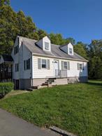 PRICE IMPROVED on this Town of New Windsor four bedroom cape home is conveniently located near Vails Gate 5 corners. Locate on a dead end street there is no through traffic. There is an additional parcel that is included with the sale. There is plenty of parking with the circular driveway. on the first floor you have the living room and the three bedrooms with hard wood floors. The kitchen has tiled flooring stainless steel appliances, breakfast island with storage and breakfast nook with access to the large two tiered deck, hot tub, oval above ground pool and large rear and side yard. The top floor has the large bedroom with an office or nursery, or library of storage room. The lower level has a separate laundry room and heated open garage with workshop and plenty of storage. New boiler, hot water heater and well pump. Close to schools, shopping , restaurants, and transportation ( minutes from Metro north Port Jervis line, Stewart International Airport, Routes 84 & NY State Thruway and Routes 9W, 32 & 94 ).