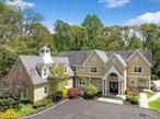Boasting a prime location in the Cold Spring Harbor School District, this estate provides 7, 600 square feet of refined living. There are two entry points to the driveway, ensuring easy access and departure, making the property ideal for hosting events with ample parking. Every corner of the home is built with the utmost integrity and craftsmanship, making it a testament to quality, from the six ensuite bedrooms to the nine opulent bathrooms. Upon arrival, you are greeted with the grandeur of the double-story entryway foreshadowing the homeâ€™s impressive scale and style. Step inside to discover a world where sophistication meets comfort. The family room, with its soaring 18-foot ceilings and a majestic gas fireplace, offers a perfect setting for both intimate gatherings and grand celebrations. Adjacent to this space is a culinary artist&rsquo;s dream. Equipped with leathered granite countertops, a marble backsplash adorned with gold Schluter edging, and double top of the line appliances, it&rsquo;s a space where form and function blend seamlessly. Descend into the newly finished basement, and you&rsquo;ll find an entertainment haven. A state-of-the-art home theater promises cinematic experiences, while the full bar and rock wall cater to the adventurous spirit. For all ages, a play area and art nook awaits, ensuring joyful moments. With plenty of space to create a personal fitness area.Venture outdoors, and the 2-acre private country club property unfolds before you. A gunite pool invites relaxation, complemented by a hot tub. The built-in grill and fire pit create an ambiance perfect for evening soirees. The beach and mooring rights also provide waterfront access. This residence is not just about luxury; it&rsquo;s about lifestyle.