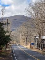 LOCATION LOCATION Quiet Secluded Peaceful Build That Family Compound Mountain Views are on Rt 212 on the way to your new property. Just 10 minutes from Woodstock NY. and Kingston NY and Saugerties both 20 minutes. Woodstock is the go to destination. shops dinning golf course trout fishing. the 30 Acres no neighbors. Your investing in a life style few have. come up to the area for a week end. stay a life time.