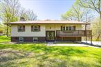 Well maintained raised ranch privately set on 2 acre parcel. Spacious floor plan includes living room w/cathedral ceiling, bay window & pellet stove, which flows seamlessly to formal dining room & eat-in kitchen w/stainless appliances. Primary bedroom w/ensuite bathroom. Lower level features family room w/fireplace, office/guest quarters, laundry room & half bathroom. Wraparound deck plus screened porch for abundant outdoor living space. Recent improvements include windows, sliding glass door, a/c condenser & septic system. Enjoy the conveniences of municipal water plus central a/c. Heated two car garage w/new insulated doors plus large shed for ample storage. Attractive parcel with expansive backyard & wooded buffers. Centrally located just minutes from schools, shopping dining, area attractions and Poughkeepsie train station.