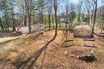 This beautiful, wooded, country property of nine acres in Sullivan County includes a pond, stream, two large sheds and a mobile home. Previously used as a hunting and fishing camp, min to the Wurtsboro & Roosa Gap State Forest! The mobile home offers seasonal occupancy, providing two bedrooms, full bath, kitchen and living room. Possibilities here for multiple uses including as a potential building site for a home -- live on-site while you build! Can also be subdivided for additional lots. Just 70 miles from NYC,  close to Bethel Woods, minutes to NYS Rte 17.