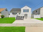 Beautifully updated 3 bedroom, 3 bath split-level home in the heart of Freeport! Offering approximately 1, 873 sq ft of living space, this home features an open concept kitchen and living room with skylights and a bright sunroom with oversized windows. The spacious primary suite includes a jacuzzi tub, while the versatile lower level serves as a gym and includes a full bath, laundry room, and walkout access to the private, fenced yard. Additional highlights include 200 amp electric, tankless hot water heater, and central air. Situated on a 50x100 lot, just one block from the Nautical Mile, marinas, shops, and restaurantsâ€”this home is the perfect blend of style, comfort, and location!