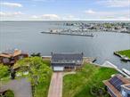 Wake up every day to million-dollar views and endless possibilities in this rare and sought-after waterfront location in West Islip. Whether youâ€™re looking to invest, renovate, or build your forever home, this is the ideal canvas for a true waterfront masterpiece.Spacious 6 Bedroom 4 Bath Colonial, perfectly situated on a prime corner lot with 215 feet of Marine-LOC bulkhead. Nestled between a protected cove and the open Great South Bay, this rare gem offers unobstructed waterfront views.The interior features an open floor plan, a chefâ€™s eat-in kitchen with granite countertops and a center island, a large formal dining room, family room with wood-burning fireplace, and a formal living room with gas fireplace. Additional highlights include an attached 2-car garage with ample storage, and potential separate guest quarters with private entrance. Donâ€™t miss this exceptional opportunity!