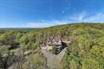 Experience Rivertown Living with Stunning Year-Round ViewsEnjoy the best of both worldsâ€”serenity and convenienceâ€”in this impressive Rivertown home just minutes from NYC, yet offering a peaceful, top-of-the-mountain feel. Set on over an acre of land, this expansive residence features an open floor plan with approximately 4, 486 sq ft of living space, including 7 bedrooms and 4.5 bathroomsâ€”ideal for comfortable living and entertaining.Perfectly located near multiple transportation options, you&rsquo;re just moments away from the vibrant Hudson River villages of Nyack and Piermont. Explore scenic waterfront parks, enjoy boating on the Hudson, and take advantage of endless biking and hiking trails. Plus, indulge in the areaâ€™s acclaimed restaurants, art galleries, and lively community events.Whether you&rsquo;re seeking a private retreat or a home that keeps you connected to the energy of the Hudson Valley and New York City, this property offers it all.