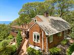 Baiting Hollow: Experience beautiful coastal living with amazing water views from most rooms. This tri-level cedar shingled mother daughter home is set peacefully at a cul de sac overlooking a nature preserve and Long Island Sound! A bird&rsquo;s eye view is yours as the osprey return each year to their nest. Celebrate friends and family in gourmet modern kitchen, Primary bedroom on first floor. The 2nd floor has 2 bedrooms and bath with upper deck with bistro table for your morning coffee or to catch the sunset. The main level offers an enclosed porch and deck all with captivating sound views. Family room with fireplace, gym and hot tub area for year-round fun! Experience privacy, trees, and deeded beach with parking. Room for a pool. Kayak, swim, fish or stroll the miles of beautiful ever-changing shoreline.