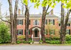 Step back in time and own a piece of Old Chatham history with the distinguished Samuel Wilbor House. Built circa 1770 and listed on the National Register of Historic Places, this exceptional estate offers a unique opportunity to live amidst authentic historic character. Once home to New York State Senator Samuel Wilbor, this is one of Columbia Countyâ€™s few remaining brick Georgians, and is a stunning example of early American architecture lovingly adapted for modern life. Set on picturesque grounds in the quaint hamlet of Old Chatham, the estate includes a beautifully updated main house, three stylishly renovated apartments, and a chic converted barn. Inside, generously proportioned rooms provide comfortable living with a total of 9 bedrooms and 10 updated bathrooms across the property. The main house features rich original white pine woodwork, hand-carved moldings, exposed beams, four fireplaces, and a striking original Palladian window. An expansive kitchen with breathtaking floor-to-ceiling windows, creates a light-filled culinary haven that blends contemporary functionality and beauty with the home&rsquo;s traditional character. Each of the three attached apartments features its own private entrance, offering flexibility for continued rental income, live-work arrangements, or in-law accommodations.The stunning barn conversion currently serves as a yoga studio and event space, offering endless possibilities for personal use or income generation. A two-car garage with a bonus workshop is ideal for creative projects or extra storage, and surrounding bluestone patios lead to a heated saltwater pool and outdoor entertaining area.This is an extraordinary opportunity to own a piece of Old Chatham history reimagined for modern living. Whether you seek a grand estate for family and friends, a unique investment property with multiple income streams, or a harmonious blend of residential and recreational spaces, the Samuel Wilbor House is an exceptional offering in a coveted location.