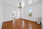 This exceptional corner unit offers a unique blend of residential and commercial space, featuring a three-bedroom, one-bath home with an enclosed deck, along with a ground-floor storefront that enjoys high visibility and convenience in a dynamic location. With easy access to transit, this property presents an outstanding opportunity for both investors and owner-occupants looking to benefit from its prime positioning and long-term value. Schedule a showing today to see all that this remarkable building has to offer.
