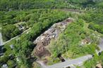 This is an incredible opportunity in a top-notch location near major highways and Interstates in the tri-state area - bordering New Jersey and Pennsylvania. Currently this property is operated as a warehouse, successful retail and bulk storage facility with a large mulch yard, and a huge supply of topsoil and hard-scape materials. Favorable HMU zoning allows for a large range of possible uses. This impressive property consists of 5 lots totaling 11.5+ acres with nearly 300 feet of frontage on both NYS Route 97 and the Delaware River and almost 1100 feet of frontage on Hook Road. The enormous road frontage on two roads offers superior access to most of the property directly from the road. Four buildings make up nearly 11, 000 SF of warehouse space with plenty of room for expansion. There are 9 bays in total and a maximum ceiling height of 12 feet with 6600+ SF of heated space. A drilled well and 2 septic systems service the property. This is an awesome offering for a trucking business, light manufacturing, construction business, lumber company, automotive/ truck repair establishment, storage warehouse facility and more. Camps and campgrounds are also permitted with planning board approval and Delaware River frontage along with a great location is an added plus! Located just minutes from the thriving city of Port Jervis, Interstate 84, NJ Transit station, and the PA/NJ borders, this property offers unbeatable convenience and access.