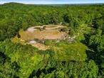 A rare and exceptional opportunity to build your dream home, with distant views, on 33 private acres. Original 10k s.f. house and pool have been demolished. The original septic was approved for 7 bedrooms.The existing driveway is approximately 1/4 mile long from the road to the building site. Convenient to shopping in Bedford and Katonah. Short distance to Metro-North trains in Katonah.The taxes on the listing reflect the assessment on the demolished house. The buyer must confirm the new assessment and taxes with the Town of Bedford.According to the town tax assessor - We confirmed that the house and pool were demoâ€™d and the 2025 Assessment will be reduced to $118, 325.Itâ€™s difficult to estimate future taxes, but your tax liability will be reduced app. 69%