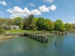 Deep water dock on East side of Mattituck Inlet. Beautiful custom cedar shingled ranch style home. 2 Bedrooms, 1.5 baths, hardwood floors, wood burning fireplace for the chilly winter days and nights. These wide expansive waterviews are yours! Quiet setting, close to Mattituck inlet. 2nd level unfinished and ready for expansion. Excellent storage, cedar closets, pantry and more! Bailey Beach nearby for a day at the beach. Come and experience the North Fork and all the farmstands, restaurants, marinas, golf courses and hamlet towns! Interior photos coming soon!