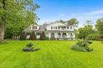 Beautifully updated 3-bedroom, 2.5-bath Colonial on 1.20 acres, located on a corner lot within a quiet cul-de-sac. This home features TWO fully finished BONUS ROOMS which provide flexible space for a studio, home office, or additional living area. The level property backs to serene woodlands, offering both privacy and natural beauty. The professionally landscaped grounds feature fruit trees, ample driveway parking, and underground utilities. Outdoor highlights include a wraparound rocking chair porch and a spacious back deck with arbor. Inside, the remodeled eat-in kitchen features granite countertops, an island with storage, tile flooring, wood cabinetry, a pantry, and a dual-sided fireplace that opens to both the kitchen and the family room. The formal dining room and living room boast rich hardwood floors, perfect for everyday living and entertaining. The primary suite includes a turret-style sitting area, private balcony, walk-in closet, and an en-suite bath with spa tub, stall shower, and marble-topped dual vanities. Two additional bedrooms feature double closets and share a hall bath. A separate laundry room with cabinetry adds convenience. The full unfinished basement is framed and fully insulated, ready for future customization. Enjoy the added convenience of a reverse osmosis water filtration system for the home. Conveniently located near I-84, I-87, Metro-North, Stewart International Airport, shopping, and outdoor recreation at Mohonk and Minnewaska State Parks.*Home has solar panels that are leased and transferable.
