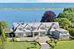 Introducing 25 Brewster Lane, a brand-new waterfront estate nestled in the prestigious enclave of Strongâ€™s Neck in East Setauketâ€”one of the most coveted and historically rich neighborhoods on Long Islandâ€™s North Shore. Set on 3.3 private, landscaped acres with direct frontage on Port Jefferson Harbor, this 13, 000+ sq ft architectural masterpiece blends timeless elegance with resort-style living.The home features 6 bedrooms and 9 bathrooms across three expansive levels, all serviced by a private elevator. Inside, youâ€™ll find soaring ceilings, radiant heated floors, five fireplaces, and a fully integrated smart home and whole-house entertainment system. Every space is oriented to capture stunning water views and natural light.The main level is designed for both elevated entertaining and everyday living. At its center is a chefâ€™s kitchen featuring a massive island, top-of-the-line appliances, a sunlit eat-in breakfast area, a formal dining room, a bar/lounge-style space with a fireplace, as well as a home theater roomâ€”perfect for hosting or relaxing in style. The first floor also includes a full guest suite with private bath, ideal for extended family or those who prefer first-floor living.Upstairs, the primary suite offers an exceptional private retreat with panoramic harbor views, a spa-like bathroom, separate his-and-her dressing rooms, a sitting room with fireplace, and a private study. The second level also includes four additional bedrooms, each with its own ensuite bathroom, providing both comfort and privacy for family and guests alike.The fully finished lower level is a destination in itself, complete with a gym, golf simulator, and game room. Two spectacular pools elevate the experienceâ€”an indoor pool with waterfall feature and an outdoor infinity-edge pool that blends seamlessly into the harbor backdrop.Beautiful patios, full outdoor kitchen, entertainment terraces, and multiple walk-out access offer seamless indoor-outdoor living. A protected mooring area just off the property&rsquo;s shoreline and potential for future dock installation provides convenient boat access for the marine enthusiast.Located just minutes from the shops, restaurants, and marinas of Port Jefferson Village, 25 Brewster Lane is a once-in-a-generation opportunity to own new construction on the water in one of the North Shoreâ€™s most private and storied settings.