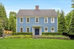 The Granby, circa 2002. Inspired by the work of master builders centuries earlier, this custom built unique home is an original work of art, designed by New England architect Lloyd Kirley . Historically correct proportions, form, scale and detail, establish an air of authenticity of its own. This classic colonial combines a spacious and comfortable open floor plan with a traditional, historically inspired design; creating warmth, charm and character most admired in antique New England homes. First impressions are everything with specialty custom millwork, hand crafted built-ins and superb details throughout the house. Reclaimed brick elements, including the wood-burning masonry fireplace, refer to an early hearth/chimney period in time. The interior reflects an informal nature with a flowing floor plan, tall ceilings, side entry mud-room for ideal organization, comfortable living spaces and room to room relationships. The function of the kitchen, this heart of the home, with Vermont Soapstone counters, oversized integrated apron sink, hand planed pine cabinets specialty crafted by Kennebec Cabinetry of Bath, Maine, and custom walnut center island, relates well to other gathering areas. Meticulously sourced fixtures and finishes selected with a focus on handcrafted aesthetic. Generous and tasteful use of windows, glass doors, transoms and a skylight, promote natural interior light and develop interactions between interior spaces and outside landscape, including the front portico with gracious columns and standing seam copper roof, louvered and shingled perfectly proportioned cupola, and multiple doors leading to the hearty Ipe deck. Incorporating antique characteristics of a historic time period including 6-10 random width flooring milled from uniquely colored, dense and highly prized reclaimed wood. The entire home is heated with multi-zoned radiant heating offering a luxurious comfort that is quiet and invisible. The attached carriage house is designed as a stylish 3 car garage space and the upper floor a generous bonus room with full bath. Oversized unfinished basement with 10 ft ceiling height and multiple access points. Walk-up attic awaits future creativity providing ample space for studio, office and more. Guided by the architectural principles of early America, this distinctive home is for those who appreciate authentic historical detailing combined with modernized living spaces. This unique Upper Nyack property close to Hook Mtn and Nyack beach, creates period character for the 21st Century, honoring the past while being admired by future generations alike.