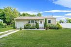 Two bedroom ranch with five year old vinyl siding and roof, new windows, upgraded electric, motion sensor lights, updated doors. Eat in kitchen with sliding doors that takes you to a huge backyard.