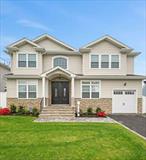 2023 Custom Built Colonial in Prime North Bellmore Location within an excellent Long Island top school district! A beautifully designed, custom-built Colonial featuring 5 bedrooms, 3 full bathrooms, and 3, 045 sq ft of luxurious living space and low taxes with home improvement exemption. Set on a quiet block in a friendly neighborhood, this home offers high-quality finishes and modern convenience throughout. Inside, enjoy gleaming hardwood floors, Andersen windows, energy star appliances, and a thoughtful layout that includes a first-floor bedroom, formal dining room, and a cozy fireplace in the family room. The chefâ€™s kitchen boasts granite countertops, opening to spacious living areas ideal for entertaining. Upstairs, the expansive primary suite includes a spa-like en-suite bath and a walk-in closet. All bedrooms feature spacious closets for convenient and organized storage. Additional highlights include a full walk-out basement and a pull-down attic for extra space. Outdoors, relax or entertain in the fully fenced, open backyard completes with an in-ground sprinkler system. Located just minutes from parks like Eisenhower and schools, shopping centers, and LIRR for an easy NYC commute. Enjoy quick access to major highways, beautiful Jones Beach, and a variety of dining and retail options. A perfect blend of custom quality, modern efficiency, and everyday comfort and luxury.