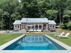 The Pool House: A Modern Mountain Escape in the Catskills.Tucked near the top of the mountain above the charming hamlet of Halcottsville, halfway between Margaretville and Roxbury, this modern and airy retreat offers a rare blend of clean architectural lines, warm natural materials, and the elusive sense of peace that only the mountains can provide. Drive past waterfalls, a beloved general store, and a picturesque kayaking lake, and arrive at this special and serene sanctuary where being high in the Catskills is defined by spa-like tranquility and panoramic views.Set on 5 private acres, this updated 3-bedroom, 2-bath home features solid oak floors, a sun-drenched open layout, and a striking wall of windows that frames the pristine landscape.The kitchen and baths are fresh and thoughtfully modernized, while a sleek metal roof adds both style and durability. Step outside to discover the seductive in-ground heated pool , and cozy firepit surrounded by nature, perfect for unwinding under the stars. If upbeat is more your speed, the(high end/$2500!) in-ground trampoline is sure to keep the party jumping.Protected (NYC/DEP owned) land is across the street which protects your privacy and your view. The location is ideal for year round fun: just minutes from skiing at Belleayre or Plattekill, golfing, hiking trails, and some of the Catskillsâ€™ most vibrant towns and farmers markets. Whether you&rsquo;re looking for a peaceful weekend retreat or a full-time mountain home, this property offers a rare combination of beauty, design, and serenity.