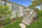 Manufactured home located within the East Hampton Village home community. Located just 2 miles from East Hampton Village. Approximately 1, 400 square, with open floor plan and high ceilings. Two full bathrooms with an ensuite off the primary bedroom.3 parking spaces are included plus a washer and dryer. Home features a large, sunny deck, an eat in kitchen with all appliances including a standalone freezer. Community is pet friendly.