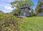 Back on the market with a new price! This bold, lighthouse-inspired waterfront home is one-of-a-kind. Located in the coveted and private East Quogue community, tucked away on a dead end street overlooking Shinnecock Bay. Features 3 stories and a wrap-around upper deck with panoramic views of the water. Perfect as a stylish, seasonal income-producing getaway or a year-round retreat. Comes with exclusive access to Hampton Point Bay Beach less than a quarter mile up the road. In close proximity to Westhampton Beach/Village so you can enjoy everything the Hamptons has to offer without the hustle and bustle. Stunning primary suite with walk-in closet and large picture windows facing the bay. The 3rd floor great room offers even more spectacular views and an abundance of natural light with extra room for sitting and entertaining, or functioning as a possible guest room or office space. Includes a large 2-car detached garage with expeditor drawings/plans to extend/attach to the main house. Large .34 acre lot and low taxes.
