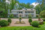 LOCUST VALLEY. Set behind a long, private drive in the heart of Locust Valley, this elegant estate spans over 3 acres of lush, manicured grounds and gardens â€”offering serenity, sophistication, and the ultimate in estate-style living. Built in 1924 and recently modernized, the stately Colonial main residence is timeless in its design, seamlessly blending classic charm with updated finishes; featuring master craftsmanship, quality materials and architectural beauty. Inside, expansive formal living areas flow effortlessly into a chefs kitchen adjacent to a stunning glass-enclosed great room conservatoryâ€”perfect for year-round entertainingâ€”with walls of windows and vaulted glass roof lines, soaring ceilings, custom lighting, and panoramic views of the surrounding landscape. This family room transports indoor living spaces to the beautiful outdoor gardens and patios. Outdoors, the estate unfolds like a private resort. A beautifully designed stone terrace leads to a luxurious pool and spa, surrounded by pristine gardens and mature trees. Nearby, a graceful fountain adds a peaceful focal point, while multiple lounge areas invite relaxation and alfresco dining. In addition to the main residence, the property includes a charming one-bedroom cottageâ€”ideal for guests or extended familyâ€”and a spacious pool house featuring two bedrooms. A lower-level three-car garage adds convenience and functionality to this thoughtfully designed compound. This rare offering combines refined architecture, secluded natural beauty, and exceptional amenitiesâ€”an extraordinary lifestyle opportunity on the North Shore of Long Island.