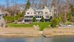 Experience unparalleled luxury in this extraordinary custom-built Riverside waterfront residence. Nestled on 1.45 acres with 9, 418 square feet of living space, this exceptional home, designed by acclaimed architect Cormac Byrne, boasts a seamless open-concept layout that promotes effortless flow throughout. Soaring ceilings and expansive windows flood the interiors with natural light, highlighting the breathtaking water views that can be enjoyed from nearly every room. Outside, indulge in the serene beauty of a sparkling pool and a private dock, perfect for those who love the water, while westward-facing vistas offer stunning sunsets. A walk-out lower level elevates the home&rsquo;s functionality, making it a rare fine in Riverside!