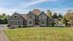 Nestled in the heart of the Hudson Valley, this striking custom-built compound offers a rare combination of luxury, privacy, and serenity. Set on 3.15 acres of beautifully landscaped grounds, the estate includes a main residence, a legal accessory apartment/guest house, a commercial-sized detached garage, an in-ground heated pool, a pool pavilion, and multiple outdoor living spacesâ€”all thoughtfully designed for relaxation, entertaining, and comfort.The 4, 900+ sq ft main house is a showcase of design and craftsmanship, featuring a grand entry foyer, formal living and dining rooms, and an expansive open-concept family room with a cozy fireplace. The gourmet kitchen, outfitted with granite counters and stainless-steel appliances, is perfect for culinary enthusiasts. A charming breakfast nook offers scenic views and opens to a deck ideal for al fresco dining. The luxurious first-floor primary suite boasts vaulted ceilings, custom closets, a spa-like bath with soaking tub and separate shower, and private access to the deck. A laundry room, half bath, and a convenient back staircase to the heated 3-car garage complete the main level.Upstairs, youâ€™ll find three spacious bedrooms and two full baths, plus a welcoming sitting nook and a professional home officeâ€”ideal for remote work or creative pursuits. The fully finished, walk-out lower level is an entertainerâ€™s dream, complete with a second full kitchen, gym, home theater with seating for nine, and a full bath. This level also offers ample storage and dedicated mechanical rooms for added convenience.The separate 36&rsquo;x32&rsquo; heated garage features a second-floor office and full bath, providing flexible space for vehicles, storage, or a private workspace. Attached is a beautifully appointed two-story guest house with its own private entrance, covered stone patio, fireplace, full kitchen, living room, laundry, and two bathrooms. This self-contained space is perfect for extended family, a caretaker, or short-term rental income. It includes a private garden, dedicated parking, and was recently approved for Airbnb-style rentalsâ€”providing a valuable opportunity to offset taxes or maintenance costs.The backyard feels like a private oasis, centered around a 38&rsquo;x30&rsquo; heated in-ground pool with a custom stone border, walkways, and ornamental plantings. The heated and air-conditioned pool house includes a changing room and luxury bath with shower. A striking covered cabana/gazebo features custom bench seating and a full outdoor kitchen with gas grill, refrigerator, microwave, and sinkâ€”perfect for entertaining on warm Hudson Valley evenings.Additional features include a charming vegetable and herb garden, a cozy stone fire pit, invisible fencing, and a custom-built kennel or chicken coopâ€”both practical and picturesque. For RV, boat, or overflow parking, a second gated driveway is discreetly tucked behind a stacked-stone retaining wall.Thoughtfully upgraded with 9-foot and vaulted ceilings, radiant floor heating throughout (including the attached garage), Marvin Integrity windows, Viessmann high-efficiency boiler (95% efficiency rating), crown molding throughout, LED recessed lighting, and spray foam insulation, this home balances comfort with energy efficiency. Conveniently located just minutes from the Taconic Parkway, Rhinebeck (10 min), Red Hook (5 min), golf courses, wineries, spas, and fine dining, this one-of-a-kind property offers the perfect blend of seclusion, sophistication, and accessibility. Located in the Red Hook Central School District.