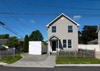 Welcome to 66 Evergreen Ave in Patchogue! This lovingly maintained 1919 Colonial with 3 bedrooms and 1.5 bathrooms offers all of Patchogue Village amenities without the high tax bill! Many updates have been done on this charming property including a new roof, siding, windows, and driveway. Features include a bright and airy open concept first floor with living room, area for a dining table, a modern eat-in-kitchen with a retro tile floor and a half bathroom for guests. Upstairs there are 2 bedrooms and a master bedroom with room for a king size bed and windows galore. Head outside to your fully fenced large and sunny backyard. Perfect for relaxing, barbequing and entertaining friends and family. Driveway with decorative pavers holds up to 3 cars. Corner property with no neighbors on one side. COME AND SEE YOUR NEW HOME!