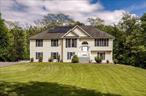 This stunning contemporary is set at the end of a long winding driveway offering privacy and tranquility on 8.6 acres in the desirable town of Clinton Corners in the heart of the Hudson Valley. The entry foyer welcomes you with elegance and scale, drawing you into a sundrenched living room with vaulted ceilings and a wood burning fireplace. The open concept living and dining area have sliding glass doors that open onto a large deck with views of the pool. The generous sized kitchen is outfitted with new stainless-steel appliances, ideal for entertaining family and friends. There are three bedrooms on the main floor. The primary suite has a large walk-in closet and a luxurious en-suite full bathroom that feels like a spa, featuring beautiful marble tile and an updated shower. The two additional bedrooms share a full bathroom. The lower level offers a spacious living area filled with natural light. With its own separate entrance and updated full bathroom itâ€™s a fantastic family room or potential as an in-law suite. Sliding doors provide direct access to the backyard and pool area. There have been many improvements made over the years. Timeless architectural details, generous proportions and a seamless blend of classic charm and modern comfort make this home a true standout. The property has a mix of open land, forested terrain and established all-terrain vehicle trails making it a great property for outdoor recreation. The property is in an area known for its scenic beauty, farm to table restaurants, and wineries. Minutes to the Stanford Recreation Park which recently underwent a major renovation: incredible playground, area for swimming, tennis and basketball courts, a walking path just to name a few. Close to farmers markets, Mashomack Polo Club, and Tamarack Preserve.