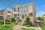 Rare Find!!!This impeccably maintained, all-brick, detached two-family home is a true gem located in Bayside at border of Whitestone. Encompassing approximately 1500 square feet each floor, this expansive property offers two units, each featuring three bedroom, two bathrooms and a balcony on each floor, providing ample living space. Interior highlights include gleaming hardwood floors throughout, generously sized living and dining areas, and kitchens equipped with stainless steel appliances and gas ranges. Additional features include gas-powered baseboard heating, Central AC,  wall units and three-zone gas heating system. The Walk-in Level elevated basement boasts high ceilings and a separate entrance, adding functionality and convenience. this home is close to major highways and transportation options, offering both accessibility and charm