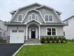 Beautiful Brand New Hampton Style Colonial! Open First Floor Layout with Huge Eat-In-Kitchen, White Quartz Countertops, Gourmet Commercial Appliances, Large Island with Seating, and Butler Pantry w/ Dry Bar. 9&rsquo; Ceilings on First Floor with Two-Story Foyer. 5 Bedrooms/ 3 Full Bathrooms Total, Including First Floor Bedroom. Four Generous Sized Bedrooms on Second Floor Including Huge Primary Bedroom and Primary Bathroom with Two Separate Vanities,  Walk-In Shower and Soaking Tub. Second Floor Laundry Room with Full Cabinets For Storage. Generous Amount Of Closets Including Double Walk-in Closets in Primary Bedroom. Wide Plank Hardwood Floors Throughout. Exceptional Craftsmanship and Detail with Extensive Moldings and Beautiful Coffered Dining Room Ceiling. Fully Landscaped with Underground Sprinklers, Fenced-In Rear Yard with Paver Patio. Excellent Location on Beautiful Residential Street with Additional New Homes Nearby. Walking Distance to Stores, Schools, Public Transportation and Railroad. One of Two New Homes Recently Completed and Ready for Immediate Occupancy.  The Village of Mineola Recently Amended the Zoning Requirements For All Residential Properties and All New Homes Will Be Significantly Smaller Going Forward. This Is One Of The Last New Homes Built Under The Prior Zoning Regulations. This House Won&rsquo;t Last!
