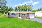 Welcome to this beautifully renovated 3-bedroom, 2-bath ranch located in the heart of Patchogue Village, just blocks from the Great South Bay. This move-in ready home features newer windows, a newer roof, vinyl siding, and a thoughtfully updated interior with modern finishes throughout.The main living area boasts vaulted ceilings, a spacious living room, a formal dining area, and an eat-in kitchen with granite countertops, stainless steel appliances, and an elegant marble tile backsplash. Both full bathrooms are tastefully finished with marble and ceramic tile.Additional highlights include raised-panel colonial doors, crown molding in the bedrooms, a heated garage, and a functional laundry/mudroom. Enjoy outdoor living in the fenced backyard with a patio, perfect for entertaining or relaxing.The home is equipped with gas heating and a separate hot water storage tank for added efficiency.Don&rsquo;t miss your chance to own this exceptionally renovated home just moments from Patchogue&rsquo;s vibrant downtown, parks, and waterfront!