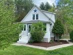 Turn key Opportunity - whether you are looking for a full time residence or second home. Often referred to as Zena Cottage by Airbnb guests, this charming home is 3 minutes to the Village of Woodstock, and a short drive to hip uptown Kingston, Rhinebeck and the NYS Thruway. 2 hrs from NYC.Set against a private wooded backdrop, this 1957 home on 1/3 of an acre has a lush lawn, spectacular perennial plantings, and a flower/herb garden. A rose arbor invites you into the adjoining sun drenched garden which has been prepped/leveled for future raised beds, greenhouse, shed, etc. and adjoins the fully fenced rear yard with a fire pit. Create your own organic garden or add a hot tub. This charming space is ready for your personal touch. Have coffee on the back deck (sunny in the morning/shaded in the afternoon for BBQ&rsquo;s) and enjoy the view and abundant local wildlife.The upstairs bathroom is brand new, boasting a walk in rain shower, thoughtfully selected designer marble, ceramic tile, high-end lighting fixtures and shiplap accent wall. Windows have been carefully placed for maximum privacy, sunshine and exterior views. Owners designed it to feel like the outdoors is melding with the interior. The second downstairs full bath has been tastefully curated - new tub, fixtures, and lighting. The den adjoins the living room which boasts a wood burning fireplace and oak floors. Large eat-in kitchen with adjacent dining room. French doors from dining room to the living room. The two, second-floor updated bedrooms and hall retain the original pine floors. Property has a new roof, new oil tank, landscape lighting, and upgraded 200 amp electric panel (ready for a hot tub and EV charging connections).