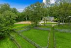 Dappled Meadows Farm. Superb Equestrian homestead in highly sought after â€˜Grantâ€™s Farm.â€™ Located on North Salemâ€™s coveted Lost Pond Lane, a stunning private gravel road - surrounded by over 1000 acres of preserved land with hiking and riding trails. Sited down a long gated driveway on over 9 pastoral acres of sprawling lawns, paddocks, mature plantings and specimen trees. Uber chic, designer renovated 4 bedroom farmhouse with incredible wrap-around porch and front entertaining area. Impressive 6-stall, four seasons bank barn with tack room, wash stall, feed room, and stunning upstairs one bedroom groom&rsquo;s quarters. Spectacular 100â€™ x 200â€™ riding arena with state-of-the-art IGK all-weather, dust free footing. 6 generous turnout paddocks. Beautiful heated in-ground gunite swimming pool with pool house and gym. Inside, opulence and exquisite craftsmanship are immediately apparent. Renovated to perfection, the home features a dramatic entry with soaring 17+ ft ceilings, a graceful bullnose walnut staircase, custom hand-forged iron railing, and radiant heated Israeli limestone floors. Venetian plaster walls and remarkable custom carpentry throughout, as well as a massive gable skylight allowing incredible natural light. Stylish powder room with drummonds vanity and unlaquered brass fixtures. The chefâ€™s kitchen features a custom reclaimed barnwood center island with Carrera marble counters, subzero appliances, and a large eat-in banquet with access to the sunroom and porch. The layout flows seamlessly into the formal dining room, living room with fireplace, and large family room with doors to the porch. There is a wonderful bar area and french doors that lead into office with fantastic built ins. Upstairs, the expansive primary bedroom suite offers a sitting room, cathedral ceilings, a massive walk in closet, and a striking bathroom with soaking tub, shower and antique Japanese vanity. There are two additional guest bedrooms that share a beautifully appointed bath as well as an additional office area. Downstairs, there is a fully finished basement with a full bathroom, access to the 2 car garage, and ample storage. This estate epitomizes luxury living in New Yorkâ€™s Equestrian capital. 3 miles from Old Salem Farm. Only 60 miles from NYC.