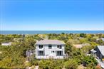 Oceanfront Escape in Cherry Grove Wake up to the sound of the waves and sweeping Atlantic views in this rare oceanfront home in Cherry Grove, Fire Island. Just a short walk from the ferry and village restaurants, this three-bedroom, three-bath coastal retreat offers the best of beach living.Spanning 1, 784 square feet, the first floor welcomes you with an open-concept kitchen and dining area that flows directly onto a spacious ocean-facing deck â€” ideal for seamless indoor-outdoor living and entertaining. A sunlit living room and full bathroom complete the main level.Upstairs, the layout features three bright and airy bedrooms, including a private en-suite and two guest rooms with private balconies overlooking the ocean, plus a full hall bath. Walls of windows flood the home with natural light and uninterrupted views of the dunes and sea.Whether you&rsquo;re seeking a peaceful personal escape or a savvy investment in one of Fire Islandâ€™s most vibrant communities, this home offers unmatched oceanfront access, and privacy.Don&rsquo;t miss this chance to own a true sanctuary in Cherry Grove.