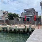 This Home is Available To Rent Weekly For $7, 000 NOT a month. Fire Island is a vacation destination.This home combines contemporary comfort with classic coastal charm with a view of the waterâ€”truly a rare find!Inside, youâ€™ll find a modern kitchen equipped with sleek stainless steel appliances, perfect for everyday cooking and hosting. The open layout flows effortlessly into the living and deck areas, creating a bright and inviting space.Step outside to your private back deck, complete with its own outdoor showerâ€”just one of the two outdoor showers included for added convenience after a day on the water or at the beachJuly weekly rent $7, 000July monthly rent $25, 000