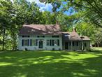 This historic home was originally built in Millbrook, New York in 1733 by one of the nine partners of the early English land grant. The carefully maintained original architectural features reflect its heritage. On 10 &#189; acres the property is a mixture of meadows and woods and bordered on 2 sides by a year round running stream. Clipped lawns surround the house and a privately situated terrace for entertaining is particularly attractive. The interior of the house is a charming combination of old and new boasting 5 bedrooms and 3 bathrooms. 4 wood burning fireplaces, beamed ceilings and wide board floors. All building components are in correct proportion. The in-home office has an outside entrance. An unfinished apartment over the 3 car garage is ready for imaginative reconstruction. The swimming pool is 20 x45 and several outbuildings complete this most attractive domain.