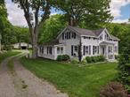 Welcome to 52 Eagle Valley Rd, a charming colonial home set on almost two acres, immediately adjacent to additional Town Parklands expanding your backyard. The home exudes timeless charm with its classic design and antique features. Hardwood floors guide you through the inviting living spaces, with large picture windows offering views of the outdoors. The eat-in kitchen provides a perfect blend of functionality and vintage style. Original details throughout the home speak to its rich history and enduring craftsmanship. The expansive property beyond the interiors offers mature landscape and flat usable land. A horse barn with six stalls adds to the property&rsquo;s historic appeal. A detached two-car garage provides practical space while maintaining the estate&rsquo;s traditional feel, and two additional barn structures. This unique residence seamlessly blends historic character with contemporary comforts, offering a serene escape. Located only 0.3 miles walking to the Village of Sloatsburg and 0.6 miles to the Sloatsburg Train Station, this home is just 36 miles from Midtown Manhattan and minutes from fantastic dining options like the Valley Rock Inn and other daily conveniences. Sloatsburg is home to Harriman State Park and Sterling Forest, offering endless opportunities for hiking, boating, and mountain biking. Serviced by the Ramapo-Suffern School District, this property combines historic elegance with convenient access to nature and city.