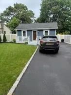 Beautifully renovated 2-bedroom, 1-bath ranch in Centereach with low taxes. Features a new roof, siding, windows, updated electric, insulation, and flooring. Modern eat-in kitchen with countertops and wine fridge. Enjoy Trex front and back decks, plus a basement with outside entrance. Move-in ready and conveniently located!