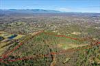 A rare opportunity to own 62.3 acres of rural vacant land in the Town of Ulster, NY. Zoned R-60 offering incredible potential for development. This expansive property is ideal for multifamily, townhouses, agricultural use, or a custom estate, with rolling terrain, wooded areas, and open spaces perfect for outdoor recreation. Conveniently located just minutes from Kingston, Woodstock, and major highways, the property provides both privacy and accessibility. With electric available nearby and flexible zoning, this is a prime opportunity for investors, builders, developers or those looking to create their dream property. Several options for parcel access.