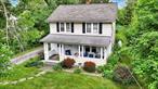 This adorable 3-bedroom, 1-bath Colonial offers 1, 906 sq ft of living space on a beautifully level 0.46-acre lot. Step onto the inviting front porchâ€”just waiting for a pair of rocking chairs. Inside, living room with french doors leading to the dining room with sliding doors that opens to the backyard with garden spaceâ€”perfect for relaxing or entertaining. . A spacious eat-in kitchen featuring brand-new appliances, lovely white cabinets, a generous food pantry, and a The home showcases rich chestnut wood details, including a classic staircase and original hardwood flooring. A detached garage adds practicality and storage.Conveniently located near Eastdale Village Town Center, youâ€™ll enjoy shopping, dining, and amenities just minutes away. A perfect blend of character, comfort, and locationâ€”this home is move-in ready and waiting for you.