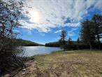 Welcome to The Legends on Tanzman&rsquo;s Sunset Beach on 7.12 acres. Water views on 3 sides and a beach with direct lake access, where the western sun will set for you, each and every day. This seller has made it so easy for the buyer, as most of the site prep has now been completed. The perfect home site has been carefully considered. Come have a look and begin living your On Golden Pond fantasy dream life today. With the trendy towns of Roscoe and Livingston Manor only a few miles away, you will have access to great popular Breweries, curated restaurants, world class fly fishing, ice fishing, hunting, hiking and so very much more. Legends on Tanzman is a quiet gated community with a shimmering 27+ acre non motor boat fishing lake. Parksville, as well, is seeing its own true renaissance, with more restaurants and businesses opening soon. Schedule your showing today and make this perfect, large lakefront lot, your own. HOA $825 annually, $69 a month takes care of road maintenance, snow plowing, and full access lake rights w use of the members only dock and beach area. Only 2 Lakefront Lots remaining! Other interior &rsquo;off the lake&rsquo; lots also available. Please inquire.