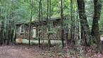 Discover a rare opportunity to own a private getaway tucked inside Camp Adventure! This beautiful 1-acre wooded lot offers endless potential. Renovate or replace the 1960 seasonal cottage with a modern home and add a deck to fully enjoy the peaceful surroundings and natural beauty. Please use caution when entering the existing structure.The location is ideal for outdoor enthusiasts and those who love the Hudson Valley lifestyle. Explore the nearby Vernooy Kill State Forest and its stunning Vernooy Kill Falls and swimming hole. Enjoy easy access to Mohonk Mountain House and Minnewaska State Park, where you can hike, rock climb, kayak, and more. In the winter, head to Hunter Mountain or Belleayre for skiing, snowboarding, and tubing. Beyond outdoor recreation, the area is filled with cultural and culinary experiences, from art galleries and theaters to farm-to-table dining and craft beverage tastings.Located just 2 hours from Manhattan, this property offers the perfect balance of seclusion and accessibility. Whether youâ€™re looking to build a weekend escape or a year-round sanctuary, this is your chance to create something truly special in the heart of the Hudson Valley. Donâ€™t miss this unique opportunity!