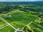 Build your dream home or investment property on this exceptional 7.2-acre parcel of land, ideally situated in the heart of the Hudson Valley. Just 5 miles from the New Paltz Thruway exit (I-87), 6 miles to SUNY New Paltz, and 7 miles to the vibrant New Paltz Village, this location offers the perfect balance of privacy and accessibility. The property features a producing apple orchard with mature trees and an active apple lease that can be canceled at any time, providing the flexibility for income potential or a fresh start for your own agricultural vision. This parcel boasts breathtaking views of the Shawangunk Mountain range, providing an unbeatable setting for a luxury home, estate, or retreat.Located in a sought-after area known for outdoor recreation and small-town charm, this land puts you minutes from top attractions. Enjoy hiking, biking, and rock climbing at Mohonk Preserve and Minnewaska State Park, or explore the Hudson Valley Rail Trail right nearby. The New Paltz area also offers farm-to-table restaurants, award-winning wineries, art galleries, and boutique shopping, making it one of the most desirable destinations in Ulster County.Whether you&rsquo;re seeking land to build a luxury home, looking for an investment property, or dreaming of a peaceful weekend escape, this unique parcel offers unmatched views, location, and potential. Don&rsquo;t miss your opportunity to own scenic acreage in one of the most beautiful and in-demand regions of New York.