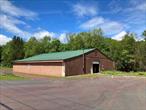 LOCATION LOCATION large warehouse on 6.36 Acres some ideas to consider. could make three leased units. the warehouse could be two leased units. each with their own entrance and space. third unit has a shop, office area, BR and bath. large parking area. would make nice distribution center, farm equipment repair shop or storage auto repair shop.smaller building would make a nice real estate office. may be trees and flower nursery. landscaping. construction company equipment site. so many options. tractor trailer parking lot. school bus. parking lot. all ways consult the local town and building inspector for approval before implimenting any plans.